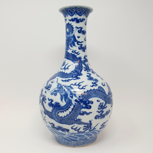 330 - A Chinese underglazed blue and white vase, decorated dragons, 35 cm high