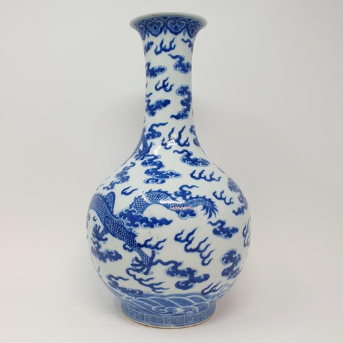 330 - A Chinese underglazed blue and white vase, decorated dragons, 35 cm high