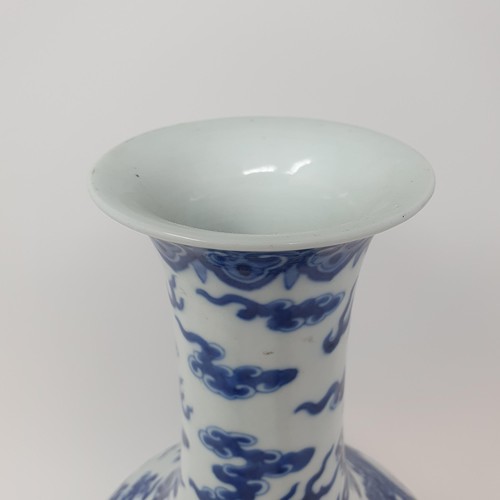 330 - A Chinese underglazed blue and white vase, decorated dragons, 35 cm high