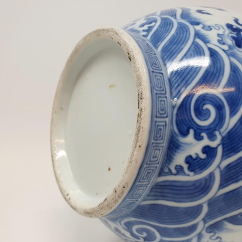 330 - A Chinese underglazed blue and white vase, decorated dragons, 35 cm high