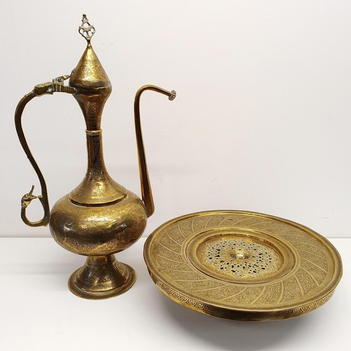 339 - An Islamic brass kettle, decorated script, 44 cm high, and a stand/burner, 38 cm diameter (2)