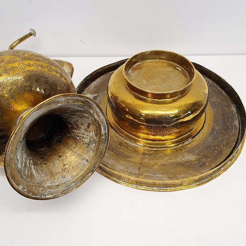 339 - An Islamic brass kettle, decorated script, 44 cm high, and a stand/burner, 38 cm diameter (2)