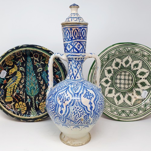 341 - An Eastern blue and white pottery ewer, with lid, 40 cm high, a bowl, 31 cm diameter, and an Iznik b... 