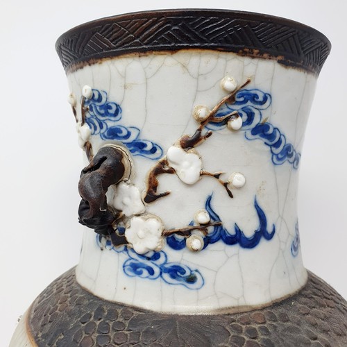 351 - A Chinese underglazed blue and white vase, with a crackled glaze, decorated mythical beasts, 38 cm h... 