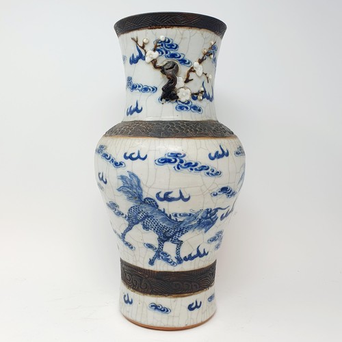 351 - A Chinese underglazed blue and white vase, with a crackled glaze, decorated mythical beasts, 38 cm h... 