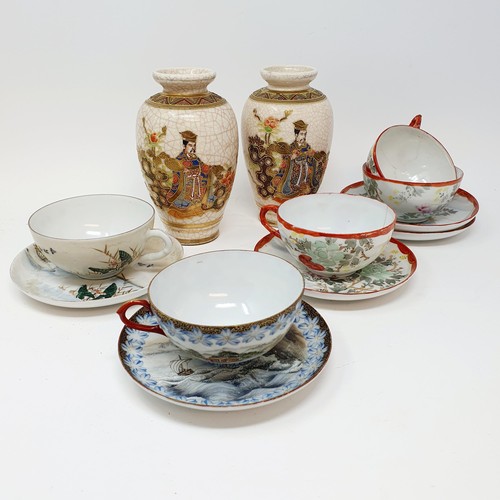 353 - A Japanese parasol, 51 cm, a pair of Japanese vases, and a group of eggshell cups and saucers (8)