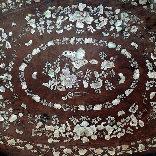 358 - A Chinese oval panel, inlaid with mother of pearl, decorated butterflies and flowers, 71 x 44 cm