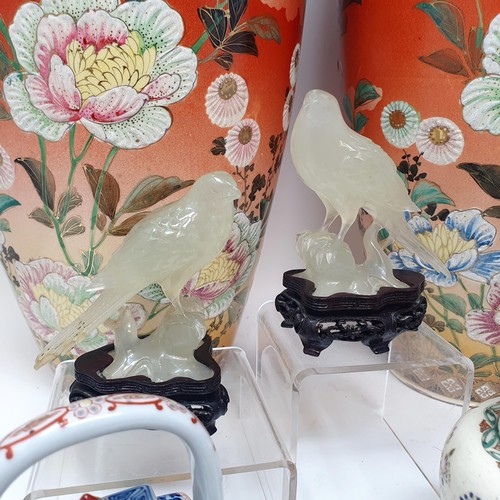 361 - A pair of Japanese vases, 50 cm high, a pair of carved green stone birds, three teapots, a part tea ... 