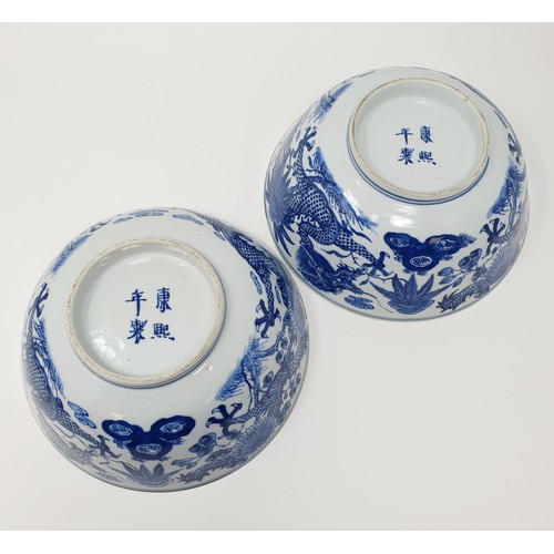 356 - A pair of Chinese porcelain bowls, decorated dragons and foliage in underglaze blue, four character ... 