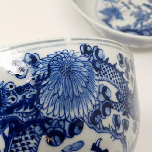 356 - A pair of Chinese porcelain bowls, decorated dragons and foliage in underglaze blue, four character ... 