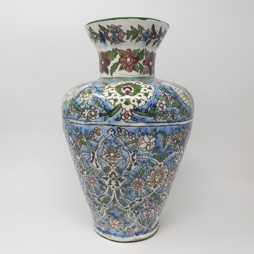 355 - A Iznik pottery vase, decorated birds, 35 cm high