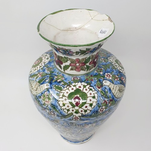 355 - A Iznik pottery vase, decorated birds, 35 cm high