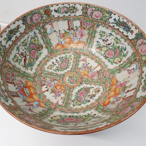 352 - A graduated set of three Cantonese famille rose bowls, 20th century, the largest 41 cm diameter (3)