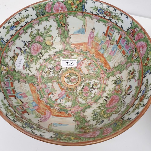 352 - A graduated set of three Cantonese famille rose bowls, 20th century, the largest 41 cm diameter (3)