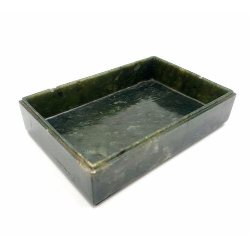 300 - A Chinese spinach-green jade box and cover, of rectangular form, the cover incised with a floral des... 