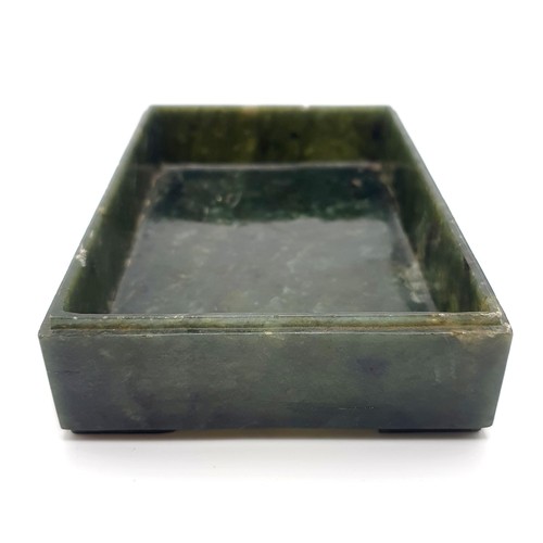 300 - A Chinese spinach-green jade box and cover, of rectangular form, the cover incised with a floral des... 