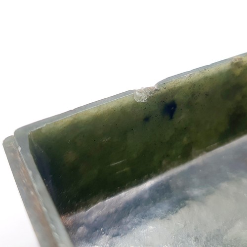 300 - A Chinese spinach-green jade box and cover, of rectangular form, the cover incised with a floral des... 