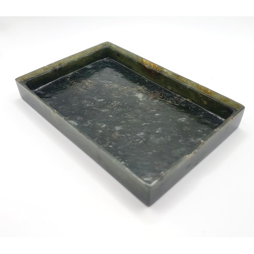 300 - A Chinese spinach-green jade box and cover, of rectangular form, the cover incised with a floral des... 