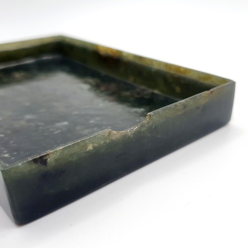 300 - A Chinese spinach-green jade box and cover, of rectangular form, the cover incised with a floral des... 