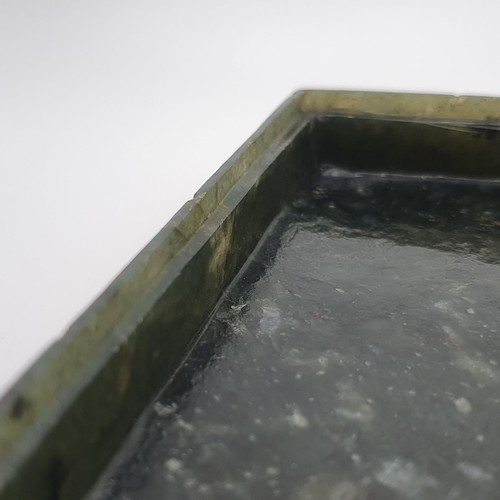 300 - A Chinese spinach-green jade box and cover, of rectangular form, the cover incised with a floral des... 