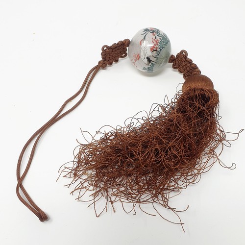 308 - An amber bead necklace consisting of 106 beads, and a painted glass bead on a tassle