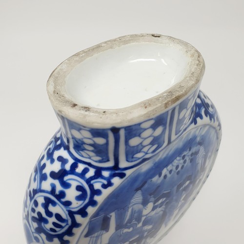 315 - A Chinese underglazed blue and white moon flask, decorated figures, 21 cm high