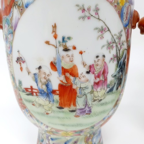 325 - A pair of Chinese famille rose vases, decorated flowers and with oval cartouches decorated figures, ... 