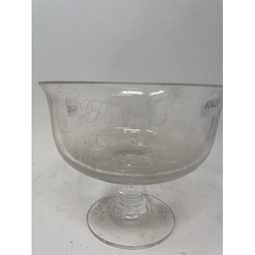 516 - An engraved glass cup, decorated a hound, and reading Patricia C&H 1969-1985, 19 cm diameter