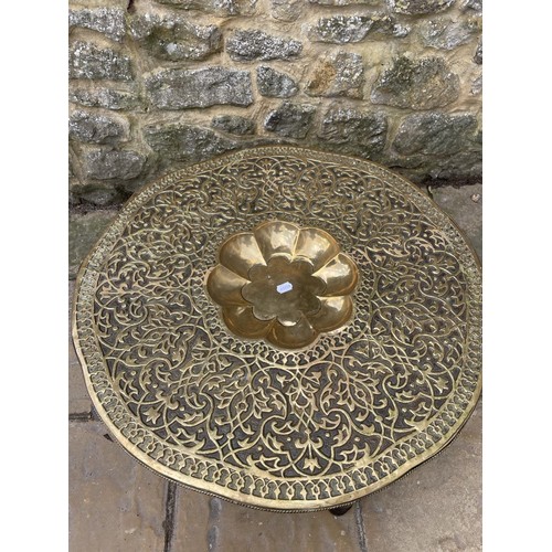 379 - A Benares brass topped table, 77 cm wide