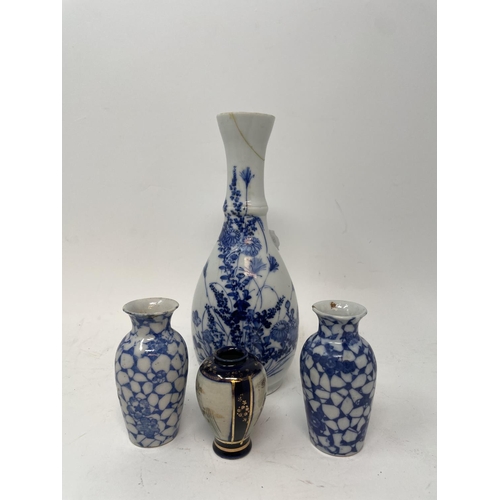 385 - A Japanese blue and white vase, a pair of Imari pattern plates, assorted other ceramics, and a caddy... 