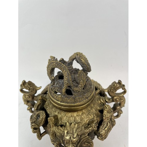 383 - A Chinese bronze censer, decorated dragons, four character mark to base, 16 cm wide