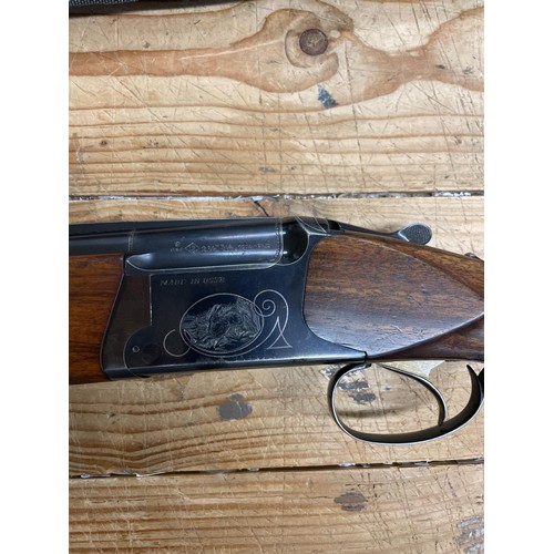 541 - A Baikal 12 bore over and under shotgun, and a slip case (2)
Note: This can only be released to the ... 