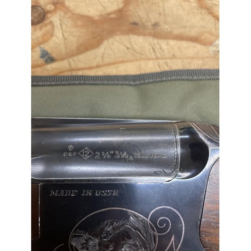 541 - A Baikal 12 bore over and under shotgun, and a slip case (2)
Note: This can only be released to the ... 