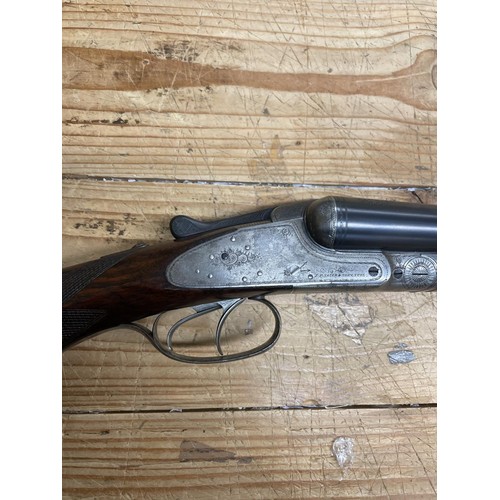 542 - A Sauer 12 bore side by side shotgun, and a slip case (2)
Note: This can only be released to the hol... 