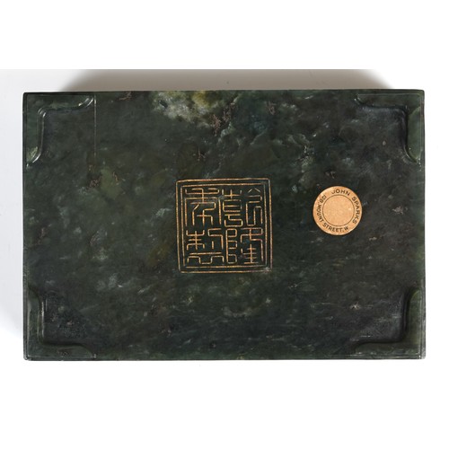 300 - A Chinese spinach-green jade box and cover, of rectangular form, the cover incised with a floral des... 