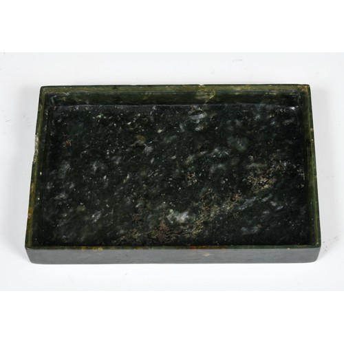 300 - A Chinese spinach-green jade box and cover, of rectangular form, the cover incised with a floral des... 