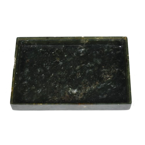 300 - A Chinese spinach-green jade box and cover, of rectangular form, the cover incised with a floral des... 