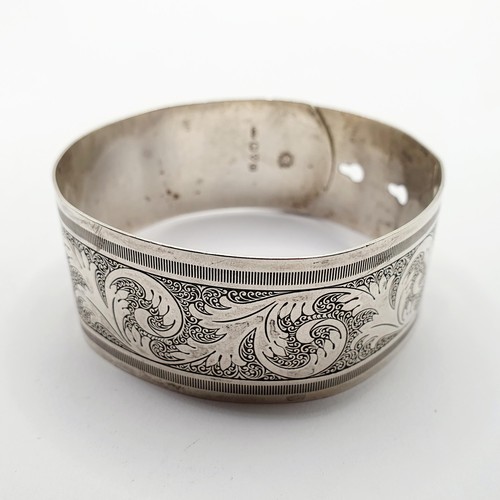 122 - A silver bangle, by Charles Horner, 29.9 g