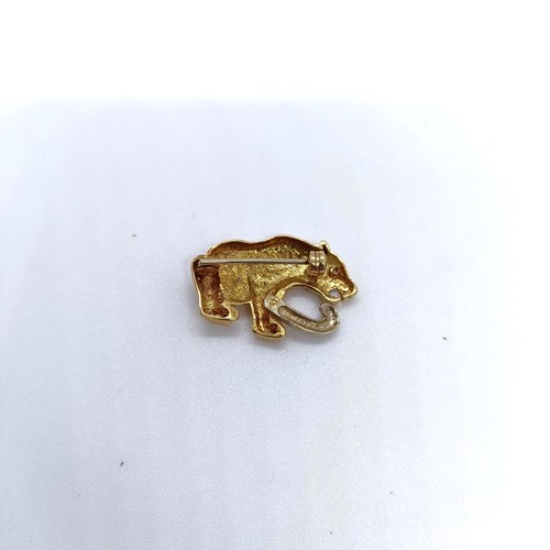 99 - A yellow metal and white stone pendant, in the form of a leopard  Provenance: From a large single ow... 