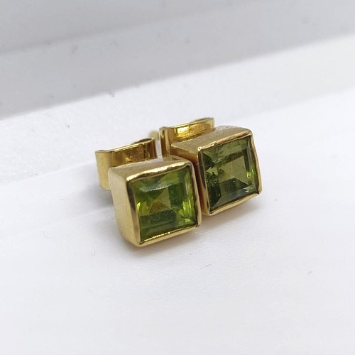 111 - A pair of 18ct gold and green stone stud earrings  Provenance: From a large single owner collection ... 