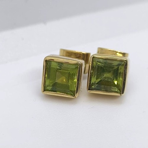 111 - A pair of 18ct gold and green stone stud earrings  Provenance: From a large single owner collection ... 