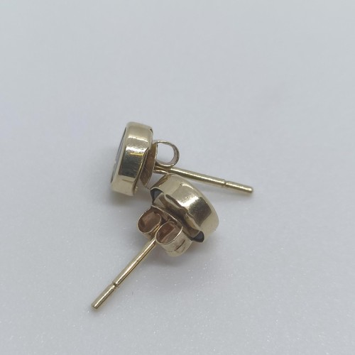 112 - A pair of 14ct gold stud earrings  
Provenance: From a large single owner collection of jewellery co... 