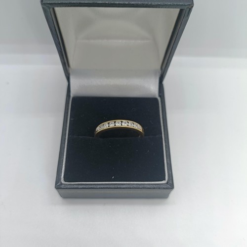 117 - An 18ct gold and diamond half eternity ring, ring size O