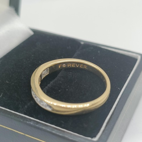 117 - An 18ct gold and diamond half eternity ring, ring size O