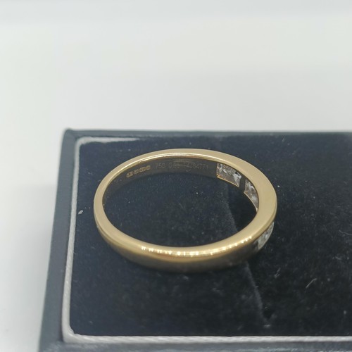 117 - An 18ct gold and diamond half eternity ring, ring size O