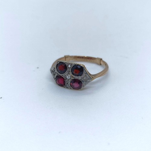 120 - A 9ct gold diamond and garnet four stone ring, ring size O 1/2