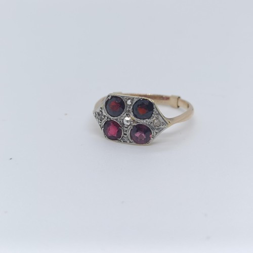 120 - A 9ct gold diamond and garnet four stone ring, ring size O 1/2