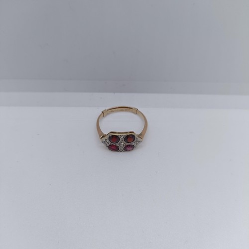 120 - A 9ct gold diamond and garnet four stone ring, ring size O 1/2