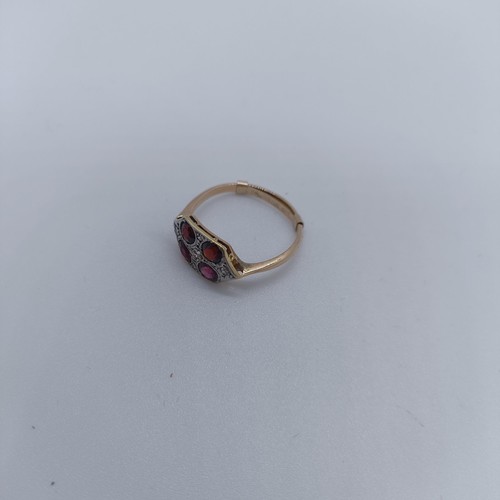 120 - A 9ct gold diamond and garnet four stone ring, ring size O 1/2