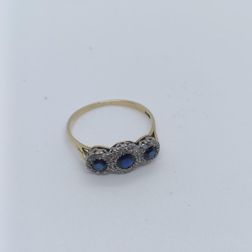 121 - An 18ct gold, diamond and sapphire ring, ring size P